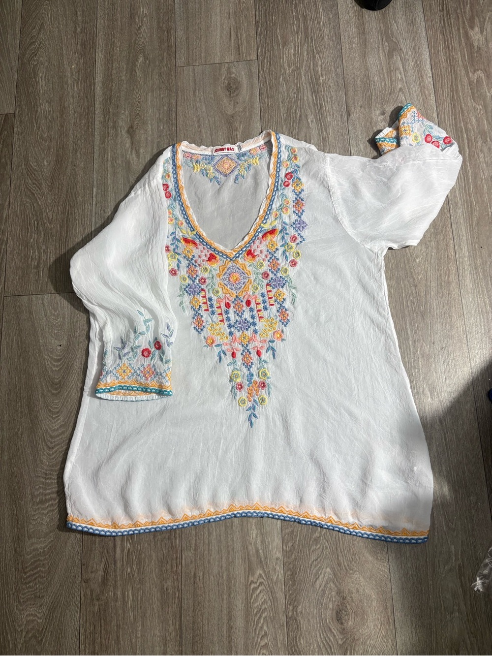 White Embroidered V‑Neck Tunic with Colorful Floral Detail